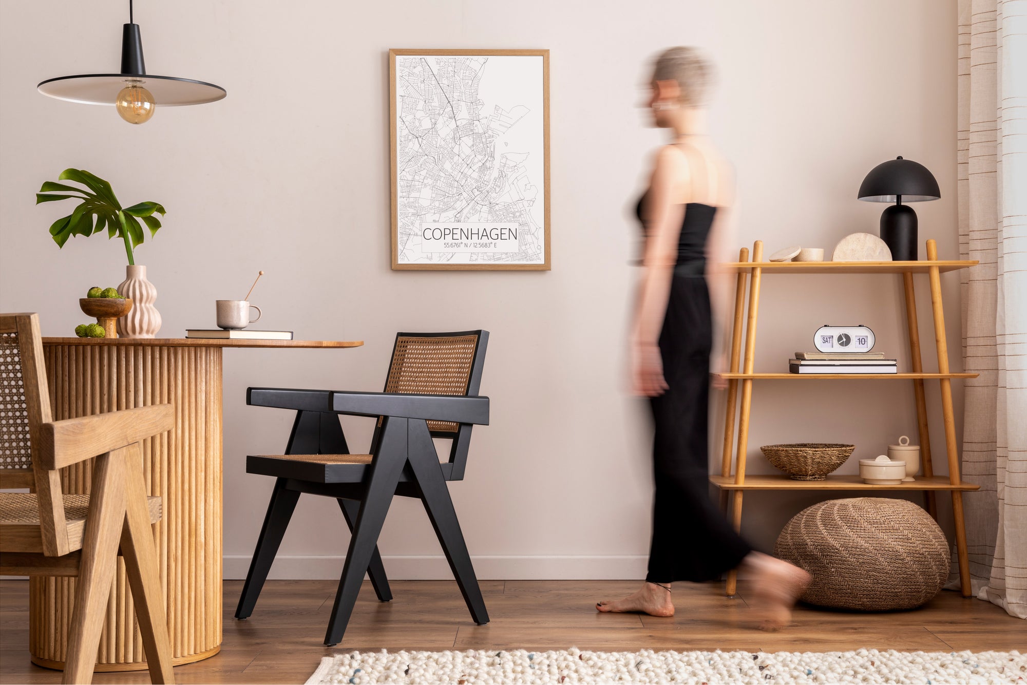 Copenhagen modern style wall print in dining room with a woman walking across the image